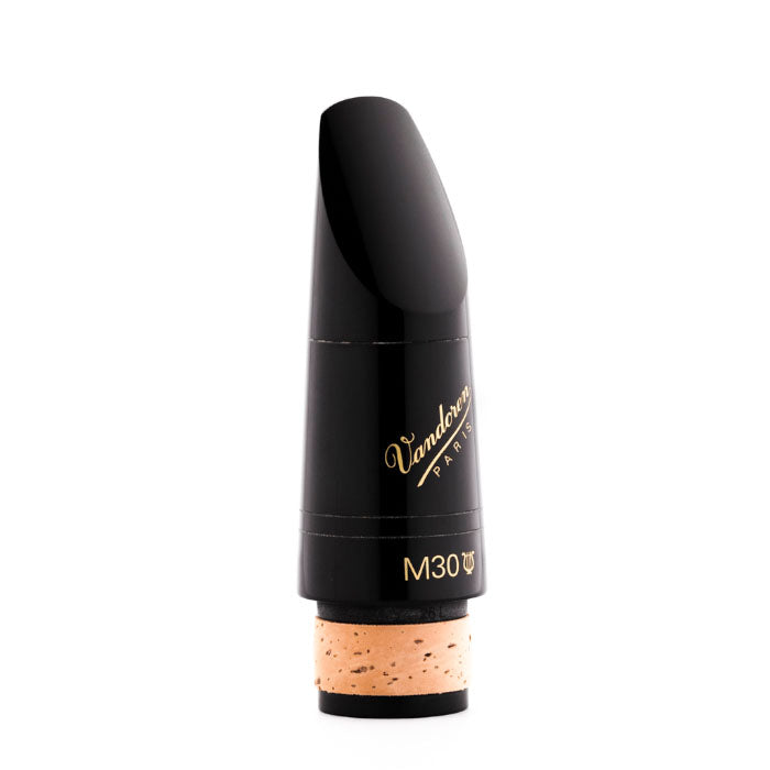 A Vandoren B flat clarinet mouthpiece model M30 with a lyre, made of plastic and cork, primarily black in color with some gold lettering.